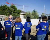 Kate Young, executive director of the Saint Francis Center in Redwood City, shows an empty parcel owned by the center that will become the site of a new all-accessible pocket park developed in collaboration with the Magical Bridge Foundation.
